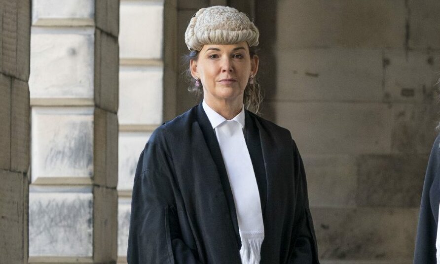 The Lord Advocate Dorothy Bain in her robes and wimple.