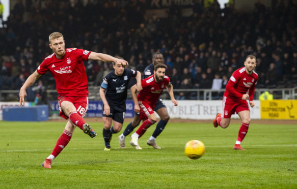 Aberdeen's Sam Cosgrove scores from the spot against Dundee las