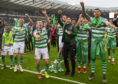 Celtic's players celebrate winning the William Hill Scottish Cup.