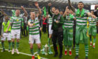 Celtic's players celebrate winning the William Hill Scottish Cup.