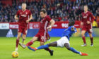 Aberdeen's Jon Gallagher, left, competes with RoPS Rovaniemi's Mahamadou Sissoko in Europa League qualifying.