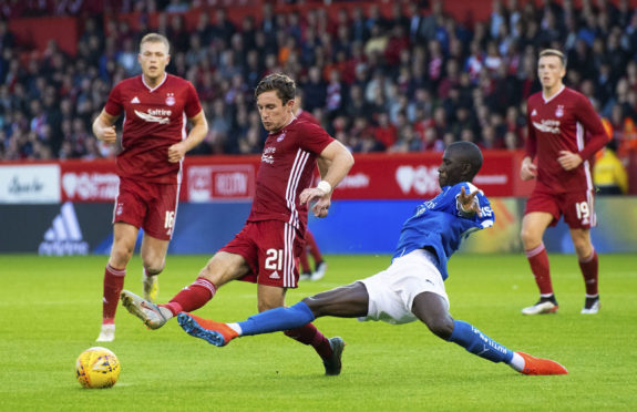 Aberdeen's Jon Gallagher, left, competes with RoPS Rovaniemi's Mahamadou Sissoko in Europa League qualifying.