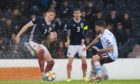 The rain continues to cause havoc as Scotland's Scott McTominay, left, is pictured in action with San Marino's Alessandro Golinucci during the UEFA European qualifier between Scotland and San Marino.