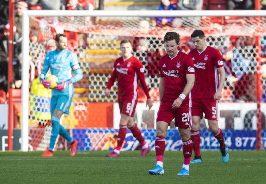 Aberdeen's Jon Gallagher is left dejected as his side go 4-0 down during the Ladbrokes Premiership match between Aberdeen and Celtic.