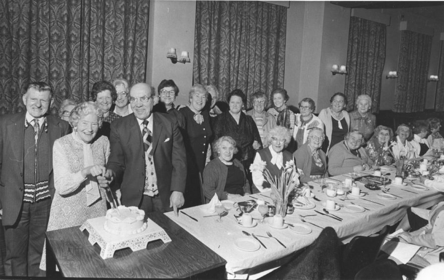 1983 - Founder member and social convener of Seaton Community Centre Mrs Mary Jack cut the centre's 35th birthday cake at their party in the Jubilee Lounge, King Street, Aberdeen. And helping her to do the honours is another founder member president Bill Tough.
