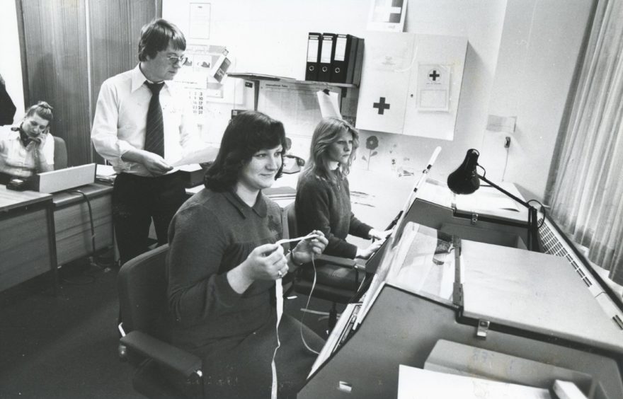 Shell 1982-02-01 Linda Bremner (C)AJL

1 February 1982

"No, that's not knitting Linda Bremner is holding...she, Lynne McCluskey (right) and Mark Holburn are busy in the Telex room at Shell Expro's Combie Road offices in Aberdeen."

Used: P&J 17/02/1982