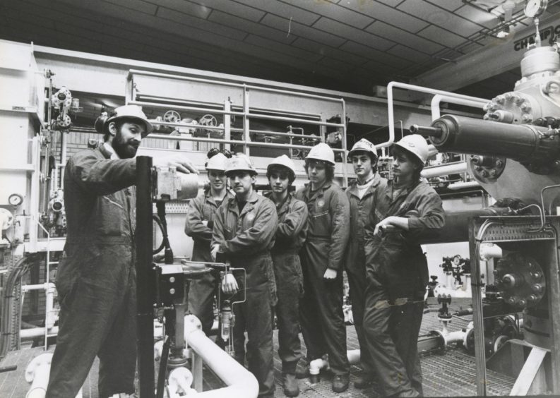 1986: Instructor Mr John McAllister of Fyvie demonstrates some machinery to a group of six students. From left: Jonathan Briggs, Westhill; Graham Wood, Portknockie; Brian Pirie, Fettercairn; Charles Christie, Lhanbryde; Robert Fraser, Westhill and Malcolm Stewart, Fyvie.