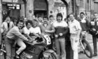 Scottish motorcycle road-race champion Brian Morrison, front left, performs the official opening of Shirlaw's Honda motorcycle dealership, 52 The Green, Aberdeen, in 1987. With him are, from left, promotion girls Sandi Barnett and Anne Keen, managing director Roy Shirlaw, salesman Alan Innes and world Grand Prix motocross contender Willie Simpson.