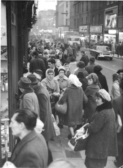 1962: Housewives should be awarded the budget-beaters' medal - they are always on the alert for the best buy and usually achieve wonders. This is a scene in George Street, Aberdeen.