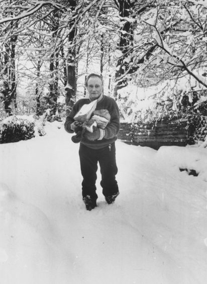 1987: Not quite so hard labour but still a chore Mr Ronald Wilson, the Toll House, Banchory, is almost up to his knees in the snow as he fetches logs from his woodshed to keep his home fires burning. Perhaps he could borrow some snow shoes from friendly Eskimos