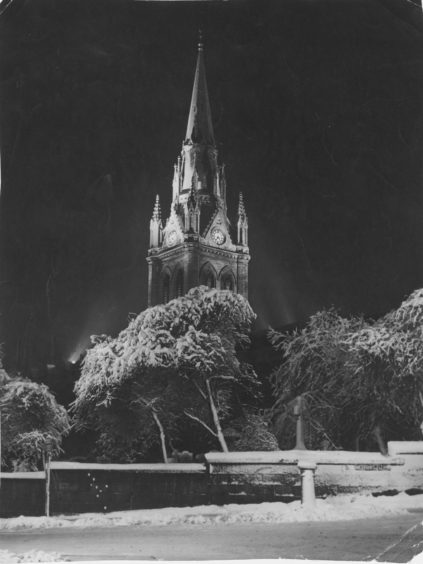 1961: The majestic spire of the West Church of St Nicholas, framed in this wintry setting, from which the midnight chimes have rung out in the past will, this year, be silent they are frozen! But the New Year will still be greeted by the big bell which will be rung for two minutes at midnight, and then the carillon will play.