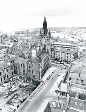 Land is cleared for work to begin on the Town House extension in 1975.