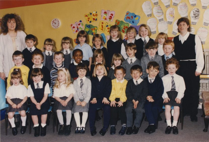 1994: Miss Fiona Galloway (left) with her Victoria Road primary one class and nursery nurse student teacher, Lynnette Harwood.