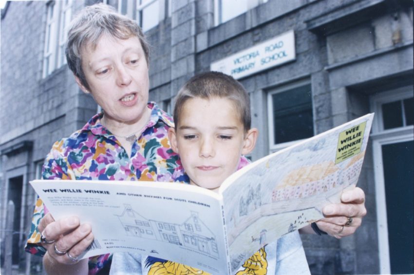 1996: Lorna Glen, head teacher at Victoria Road School, Torry, reads a new book of nursery rhymes which was illustrated by her pupils. She is joined by William Kirton, 8, who has a picture in the book.