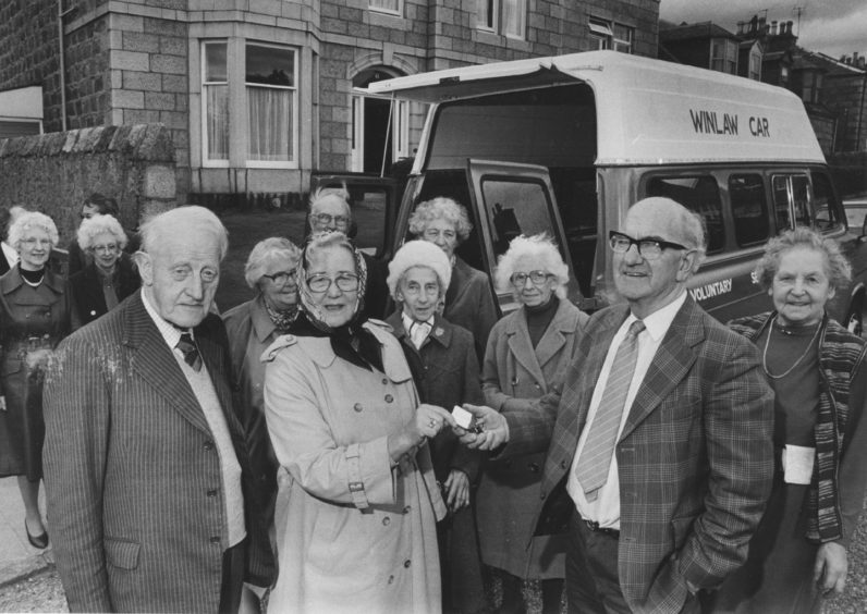 1985: A new Transit ambulance is presented to Voluntary Service Aberdeen yesterday. Half the cost was met by the Winlaw Trust, and in the picture trustees James Collie and Miss Mary Wishart hand over the keys to voluntary driver Doug Singer while residents and staff of Deemount House look on. VSA said the ambulance would be used to provide outings and trips for housebound people.