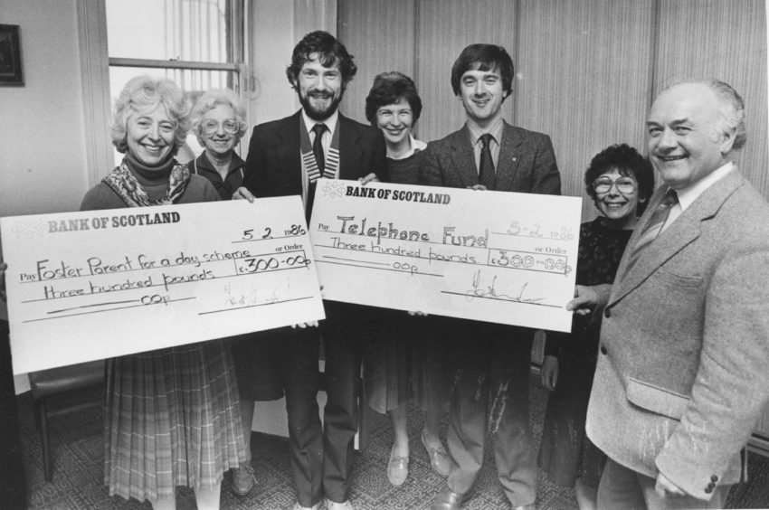 1986: Two cheques, each worth £300 were handed over to the Voluntary Service Aberdeen, yesterday. Centre left is Mr Quentin Tweedie, chairman of Aberdeen and Deeside Round Table, presenting a cheque to Mrs Jean Drey, VS publicity officer. The cash is to boost the Foster Parent for a Day scheme. Handing over the other cheque, towards the Telephone Fund for Housebound Old Folk, is table community service convener Mr Bill Slater (centre right). Accepting is senior social worker Mr Jim Mathieson. In the background are, from left, Ann Cowie, Margaret Brooker and Margaret Whyte.