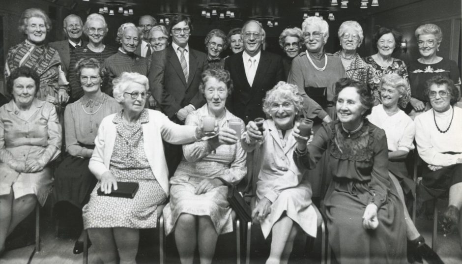 1986: Thrift pays. That was the message that came from the 21st birthday party to celebrate the coming of age of Voluntary Service Aberdeen, whose Thrift Shops in the city will next year have netted £1,000,000. Seated front are four of the original shop volunteers who worked in VS's first premises at 183 King Street. Left to right are: Mrs Jessie Sutherland, Mrs Gladys Thomson, Mrs Jean Cooper, and Mrs Lilian Morrison, all Aberdeen. Also pictured are Mr Brian Mennie, manager of the Gallowgate shop, and Mr Gordon Hardie, chairman of Voluntary Service, Aberdeen. The birthday party took the form of a buffet supper, held last night in the city's Station Hotel.