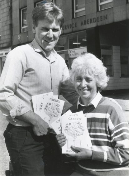 1989: Bert Lawrie, Development officer for the elderly and Jean Longley, publicity officer, with the Carer's Handbook.