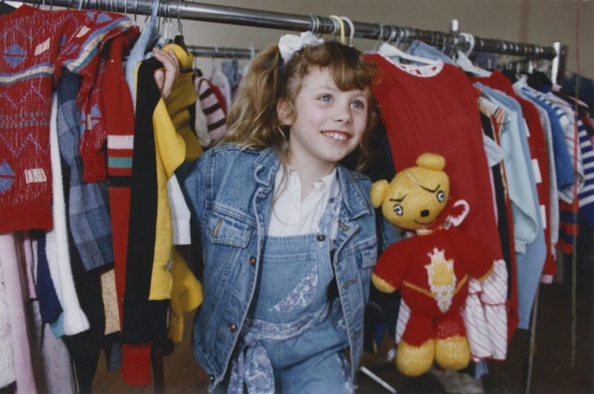 1992: Ashleigh Davies (7) helps Voluntary Service Aberdeen move their children's department.