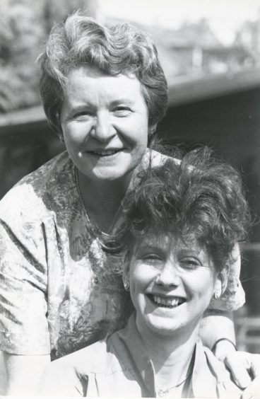 1992: It wasn't hard for Cynthia Beaton (left) and Dorothy Miles to volunteer smiles in the Aberdeen sunshine yesterday. Both work for Voluntary Service Aberdeen and both will receive their certificates in social services tomorrow at the Dundee campus of the Northern College.