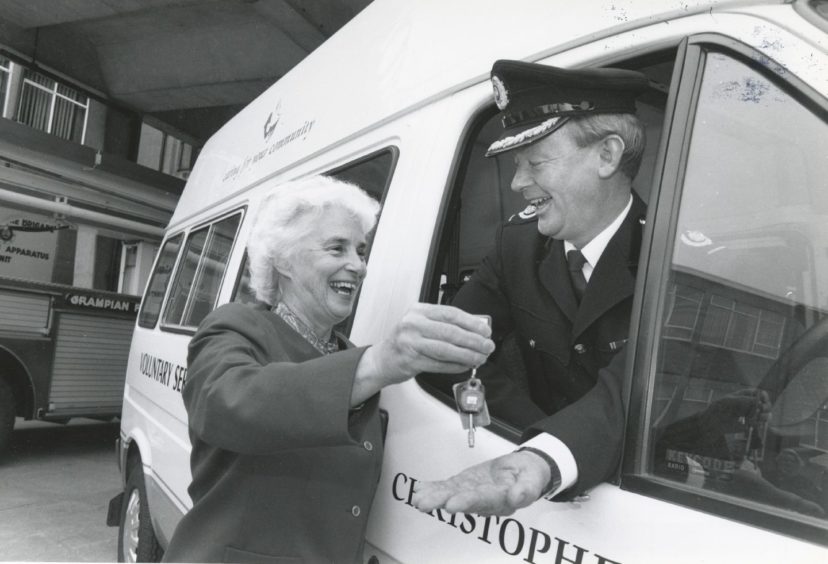 1992: Voluntary Service Aberdeen chairwoman Doris Meston and Deputy Firemaster Sandy Lobban enjoy a joke at the handing over of keys to the new Christopher Car at North Anderson Drive fire station.