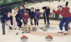1995: Organiser Dennis Davidson roars on his rink from left, Stephen Birrell, Julie Fletcher, Ian Flett, Gwen Davidson, Jim Preacher, Chris Burns and Drew Leil.