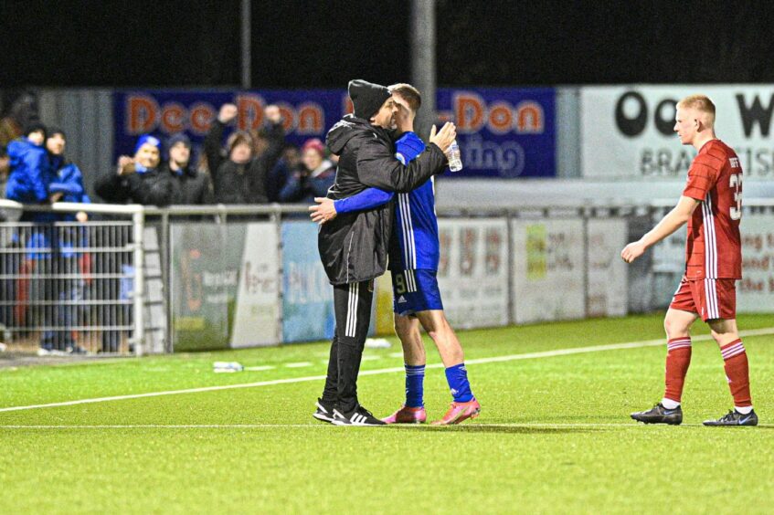 Cove Rangers boss Paul Hartley and Mitch Megginson