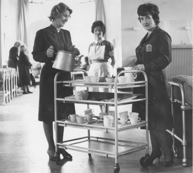 1966: Mrs Osborne (left of the trolley) handing out tea in one of the wards at Kingseat, and (below) helping at the tea stall.