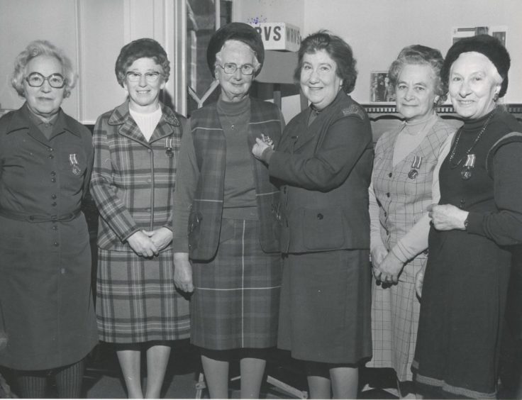 1979: Grampian Region organiser for WRVS, Mrs Marcelle Morrison (third right), presents Mrs Jean Mackie, with her second clasp for her WRVS medal to mark 40 years' service with the WRVS. Looking on are other members who received the WRVS long service medal (left to right) Mrs Marian Taylor; Mrs Alice Gorrod, Mrs Mary Hackett, and Mrs Alice Allan.