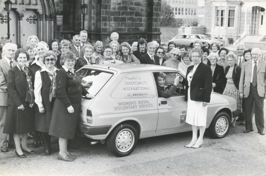 1984: Women's Royal Voluntary Service regional organiser Mrs Muriel Scanian (seated in car) is presented with the keys to the vehicle by Miss Norma Michie, president of Soroptimists International of Aberdeen at the WRVS Office last night. The van will be used for the Meals on Wheels service. The cost of the car was met from the proceeds of fund-raising activities by the 26 members of Aberdeen Soroptimists.