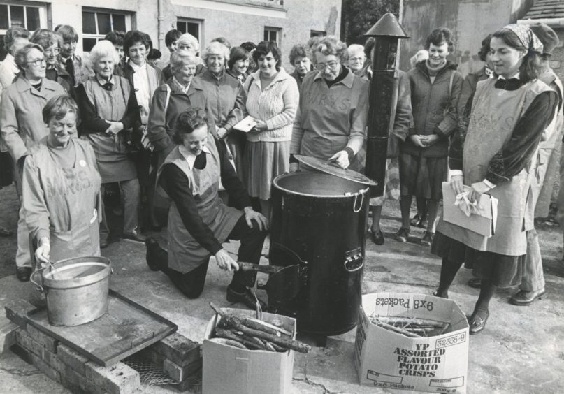 1984: Banchory WRVS members (left to right) Elaine Galloway, Pru Wilson, Jean Shinnie, and Diana Milligan show visitors different forms of emergency cooking.