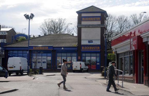 The former Blockbuster unit would be turned into a drive-thru under the plans.