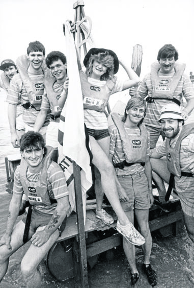 1986: Annette Hailwood adds a touch of glamour as the roustabouts launch their rig-raft in preparation for the Peterhead Scottish Week Raft Race in July 1986.