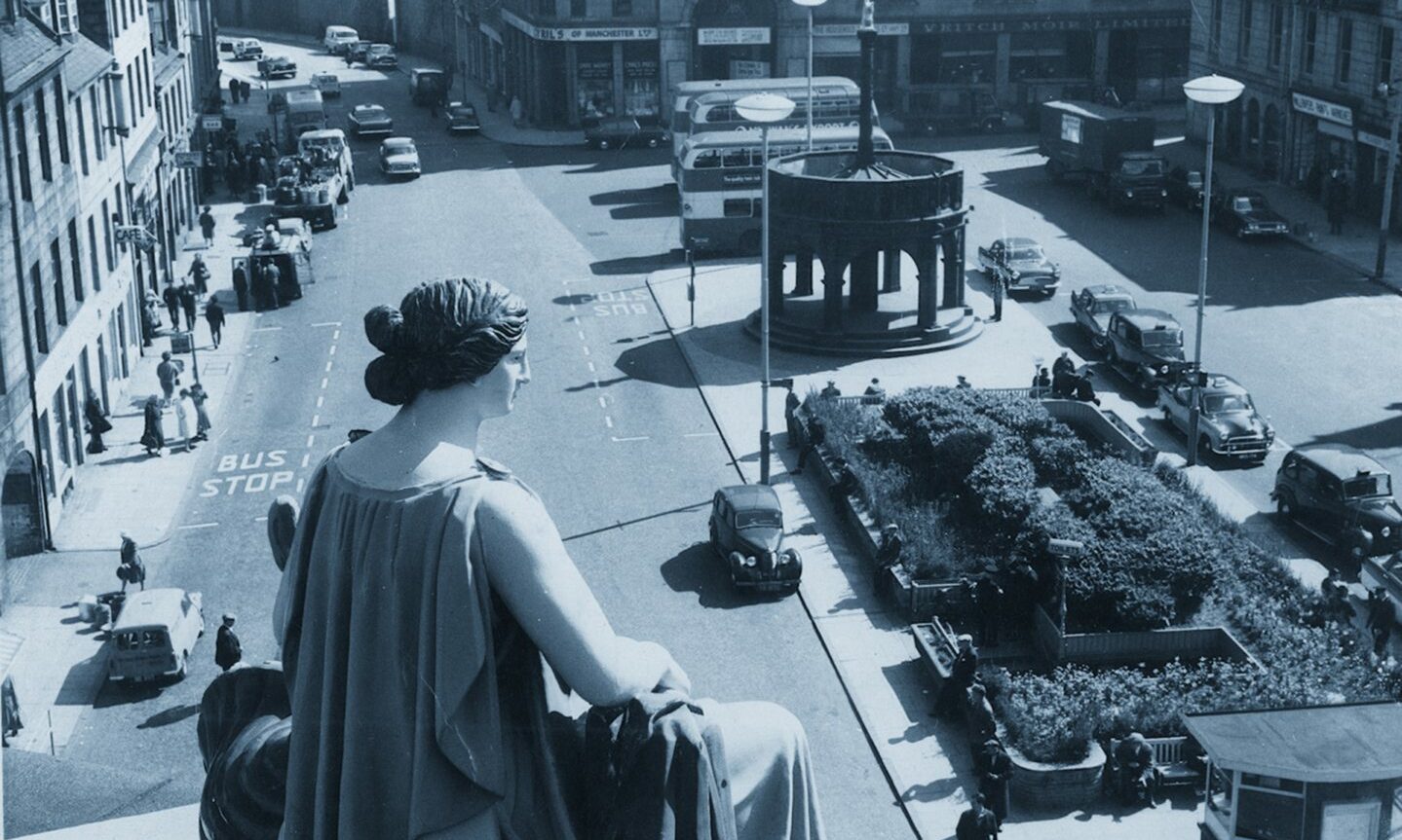 The Goddess of Plenty surveys the Castlegate from the top of the Clydesdale Bank (now Archibald Simpson's) at the corner of King Street, Aberdeen, in November 1968. The area was pedestrianised in 1990.