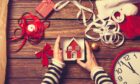 Christmas picture, details of hands and ribbons. Scottish businesses to make your home and garden ready for Christmas