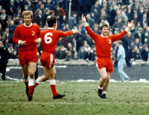 Martin Buchan congratulates Joe Harper during the 1970 Scottish Cup final win.