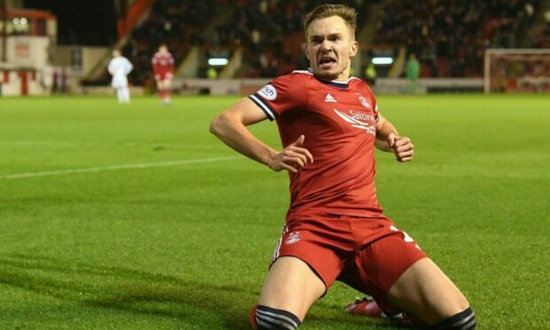 Aberdeen's Ryan Hedges celebrates the opening goal in the 2-0 defeat of Livingston.