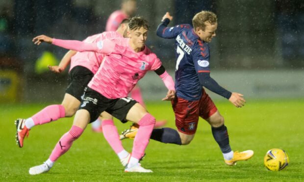 Inverness midfielder Roddy MacGregor, left, challenges Kilmarnock's Rory McKenzie.