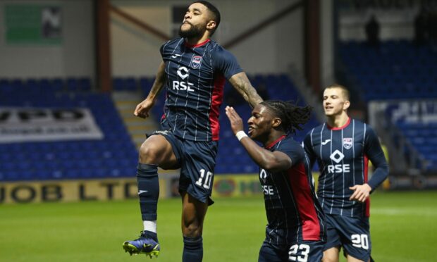 Dominic Samuel celebrates netting for Ross County against Dundee.