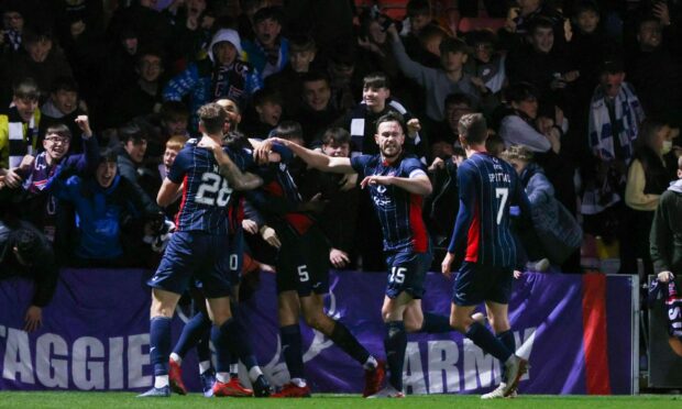 Ross County celebrate with fans against Dundee.