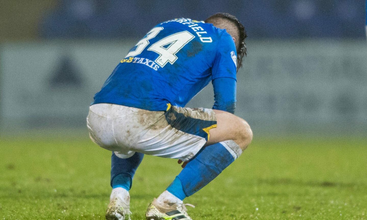 St Johnstone's Jacob Butterfield despairs at full-time after losing against Ross County.