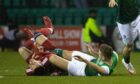 Ryan Porteous tangles with Aberdeen's Christian Ramirez at Easter Road in midweek.