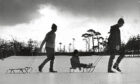 1968 - Graeme McKay, Gordon Raitt and Simon Shepherd make for the sledging slopes in Hazlehead