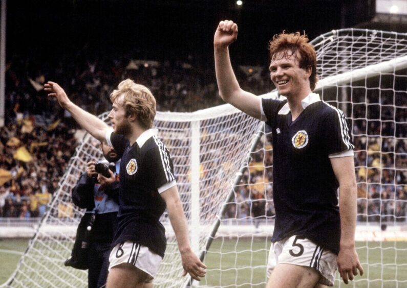 Scotland's Steve Archibald (left) and Alex McLeish salute the fans as they leave the field after their victory against England at Wembley in the Home International Championship in May, 1981. Image: SNS.