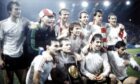 Aberdeen celebrated their Super Cup triumph over Hamburg.