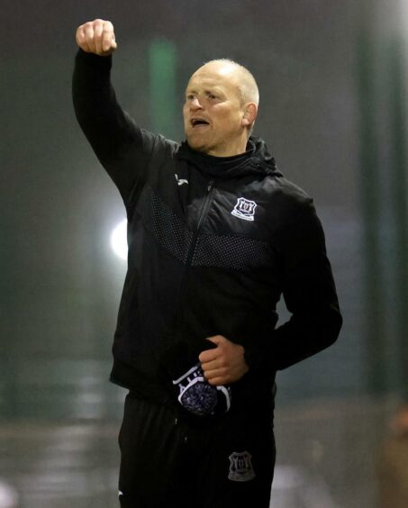 Elgin City manager Gavin Price gives instructions to his players