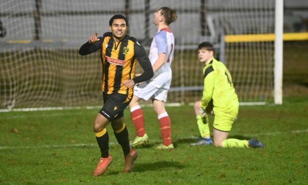 Huntly's Robbie Foster celebrates the home side's third of the afternoon against Turriff. Picture by Chris Sumner