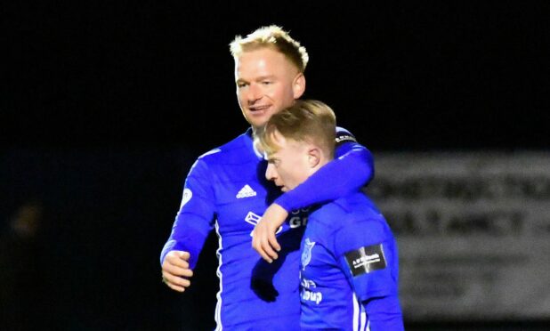 Jordon Brown (left) congratulates Peterhead team-mate Lyall Cameron