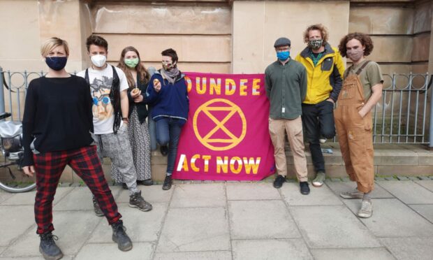 Extinction Rebellion protesters, from left,  Joanne Venables, Federico Pastoris, Fiona Cormie, Alison Orr, Marco Tenconi, Guy Bowen and Mark Quinn.