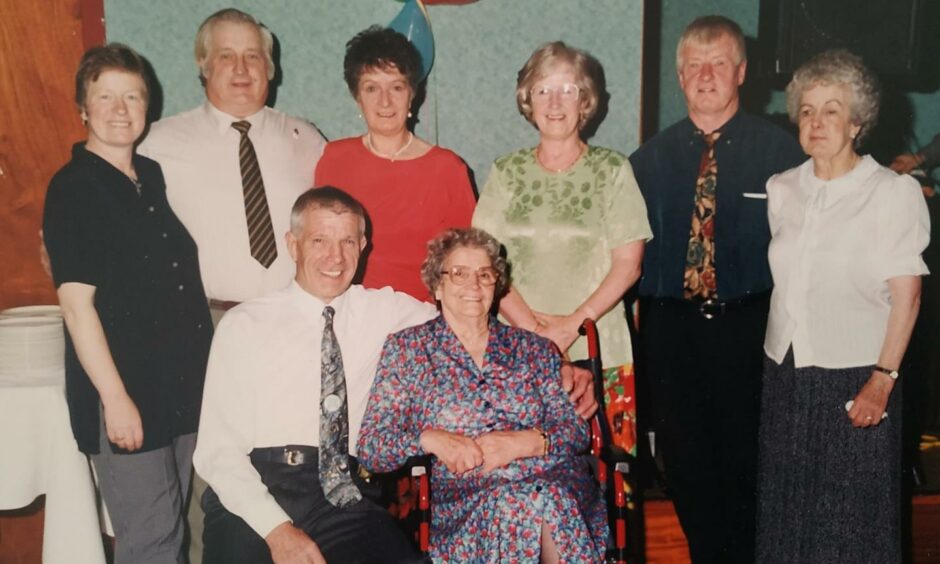 Isabella Donald with her children at her son Jim's 60th birthday. Pictured (L-R): Flora, Eric, Jean, Jim, Isabella, Mary, Gordon and Cathie.